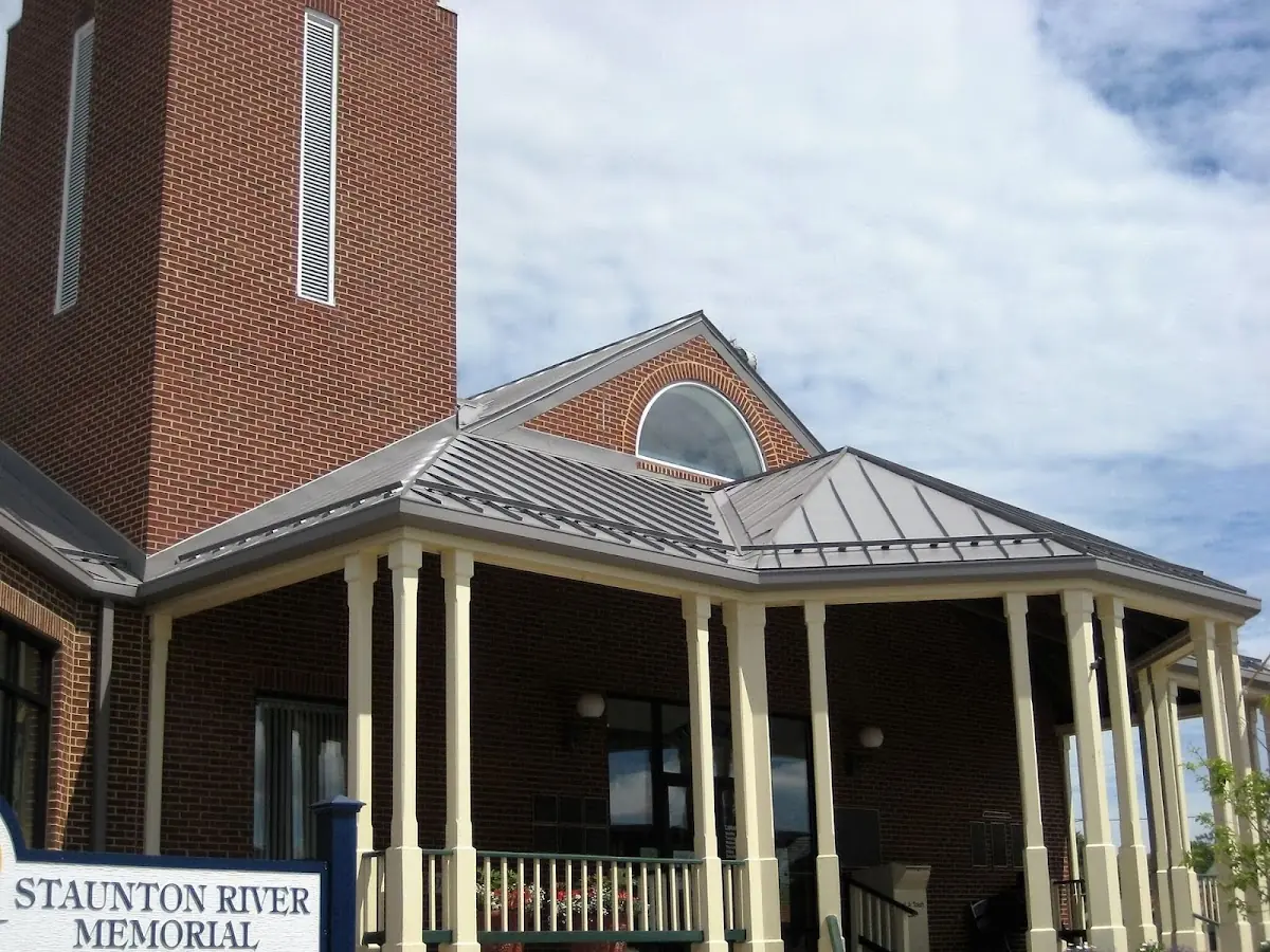 Skilled roofing craftsmen working on a residential roof in Holmansville